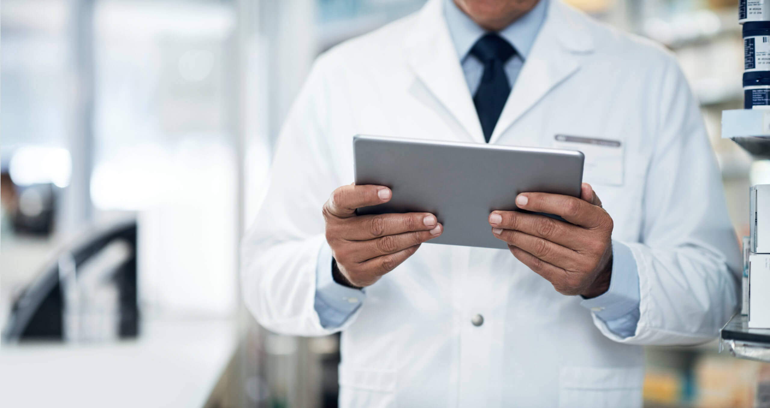 physician reading newsletter