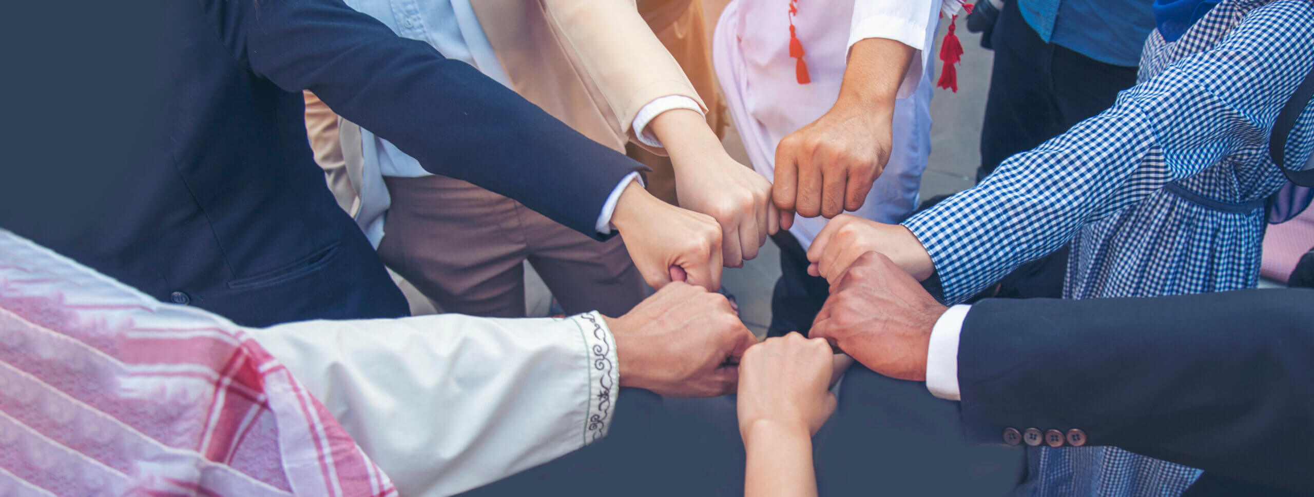 group of diverse professionals uniting in teamwork