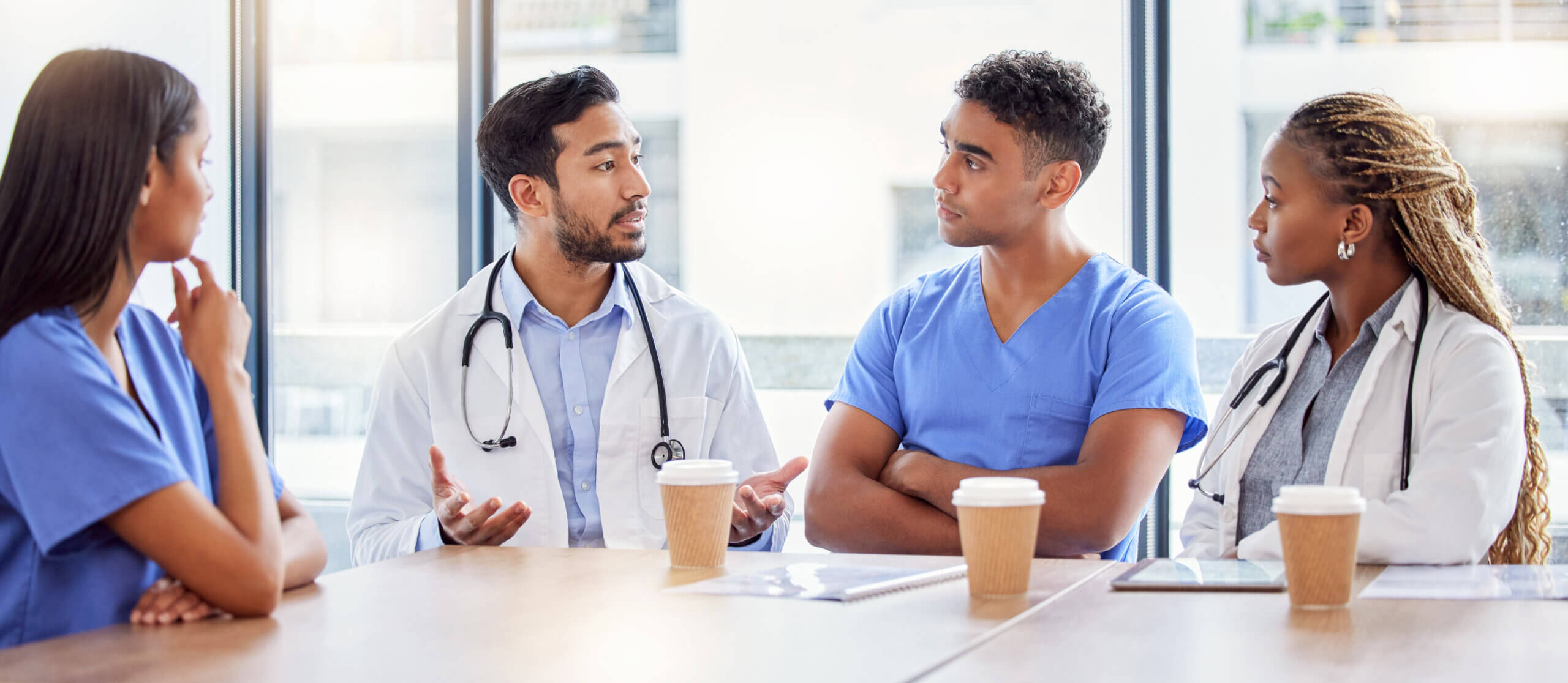 Doctors discussing effects of coffee consumption on health