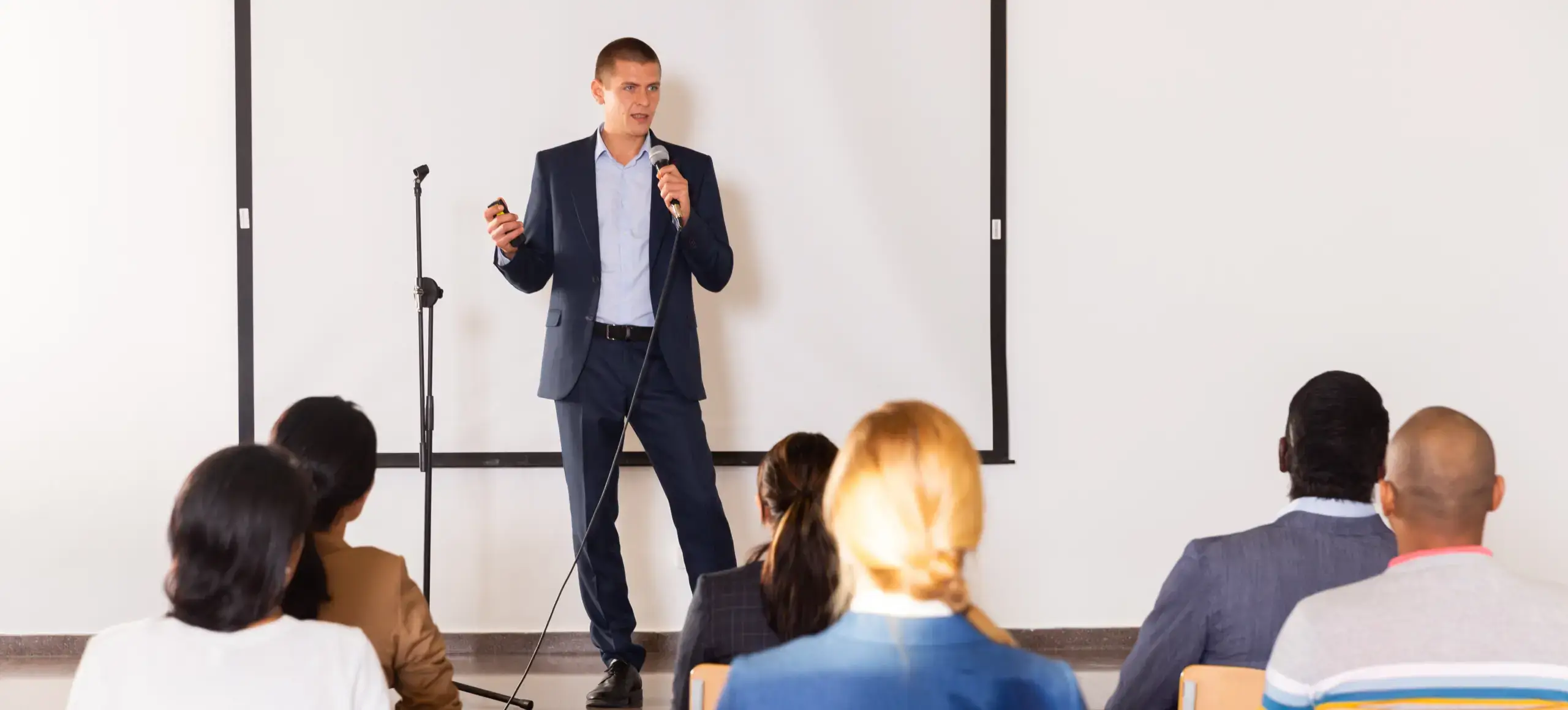 Man speaking at scientific conference.