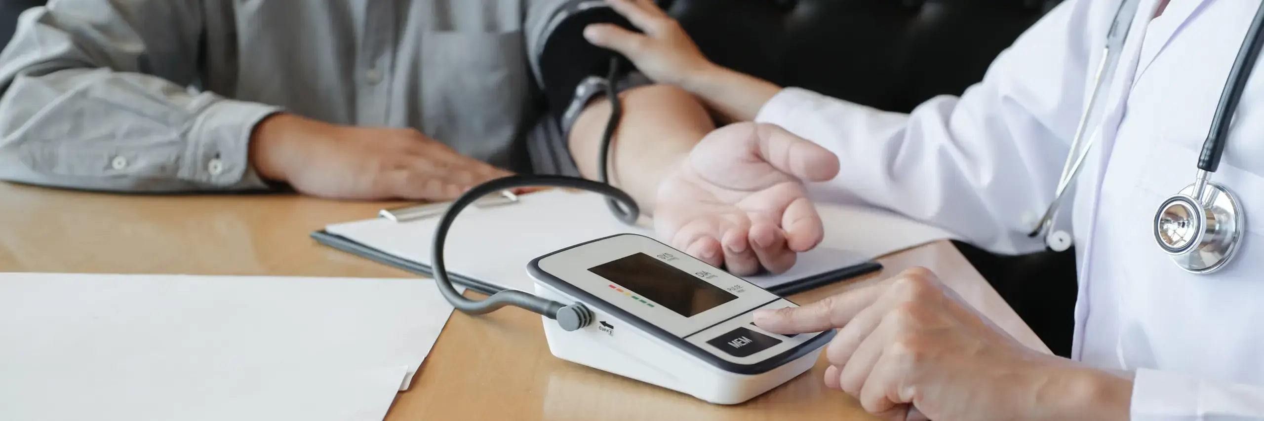 doctor checking blood pressure