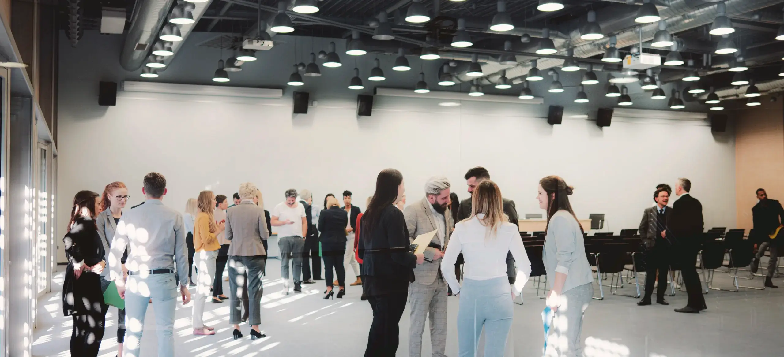 people convening in a conference room