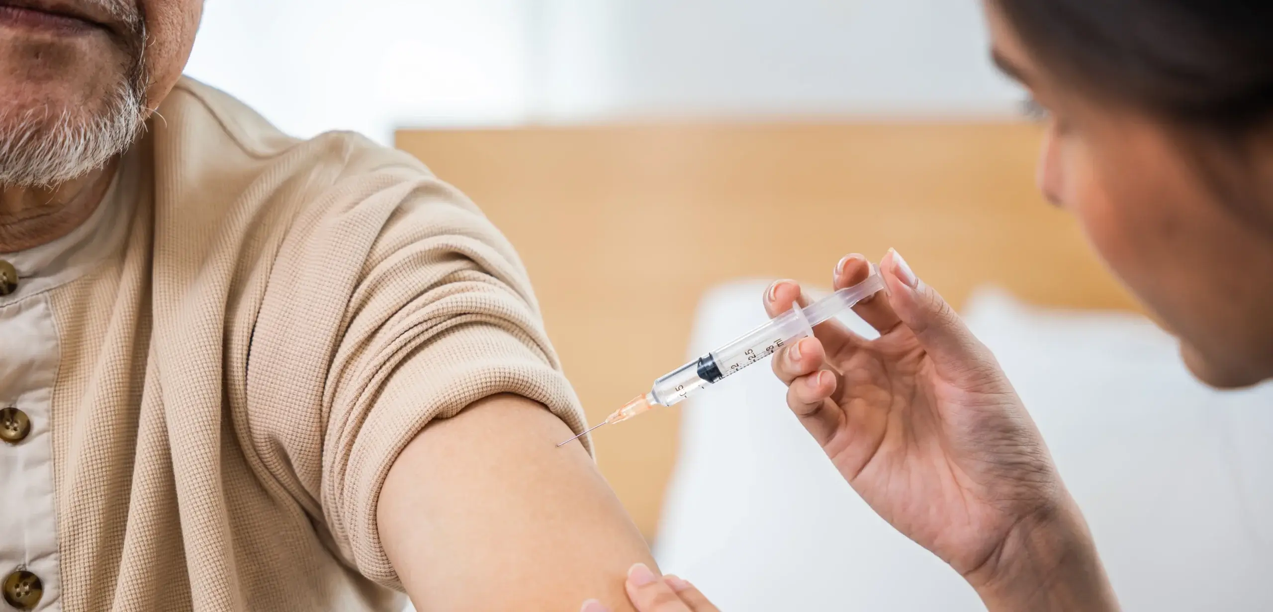 medical professional administering covid vaccine