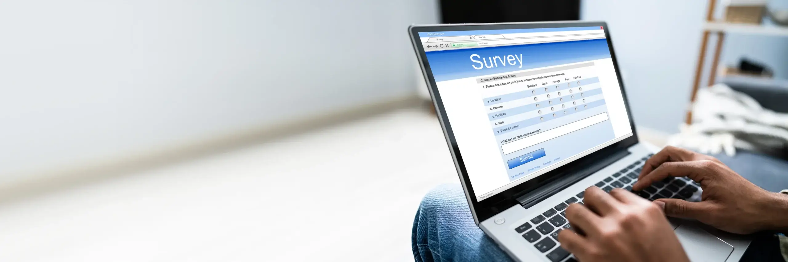 Man Filling Online Survey Form On Laptop