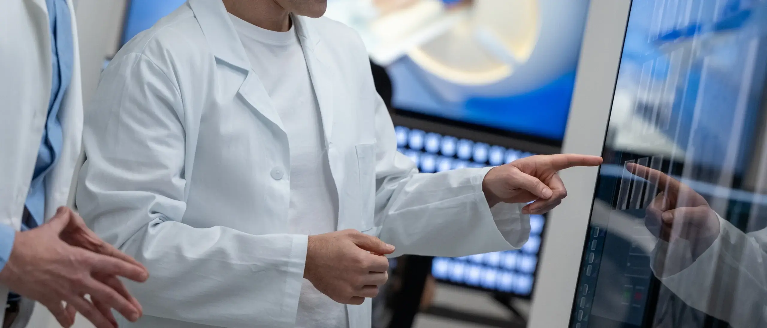 Male radiologists looking at the MRI images on the lightbox