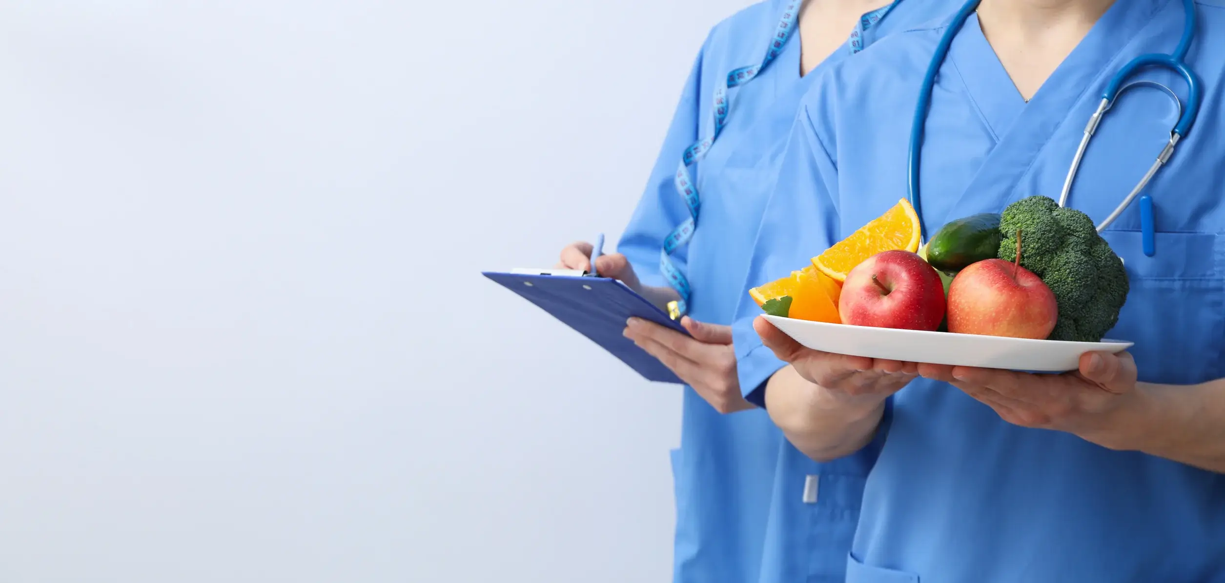 nurses with clipboard and healthy food