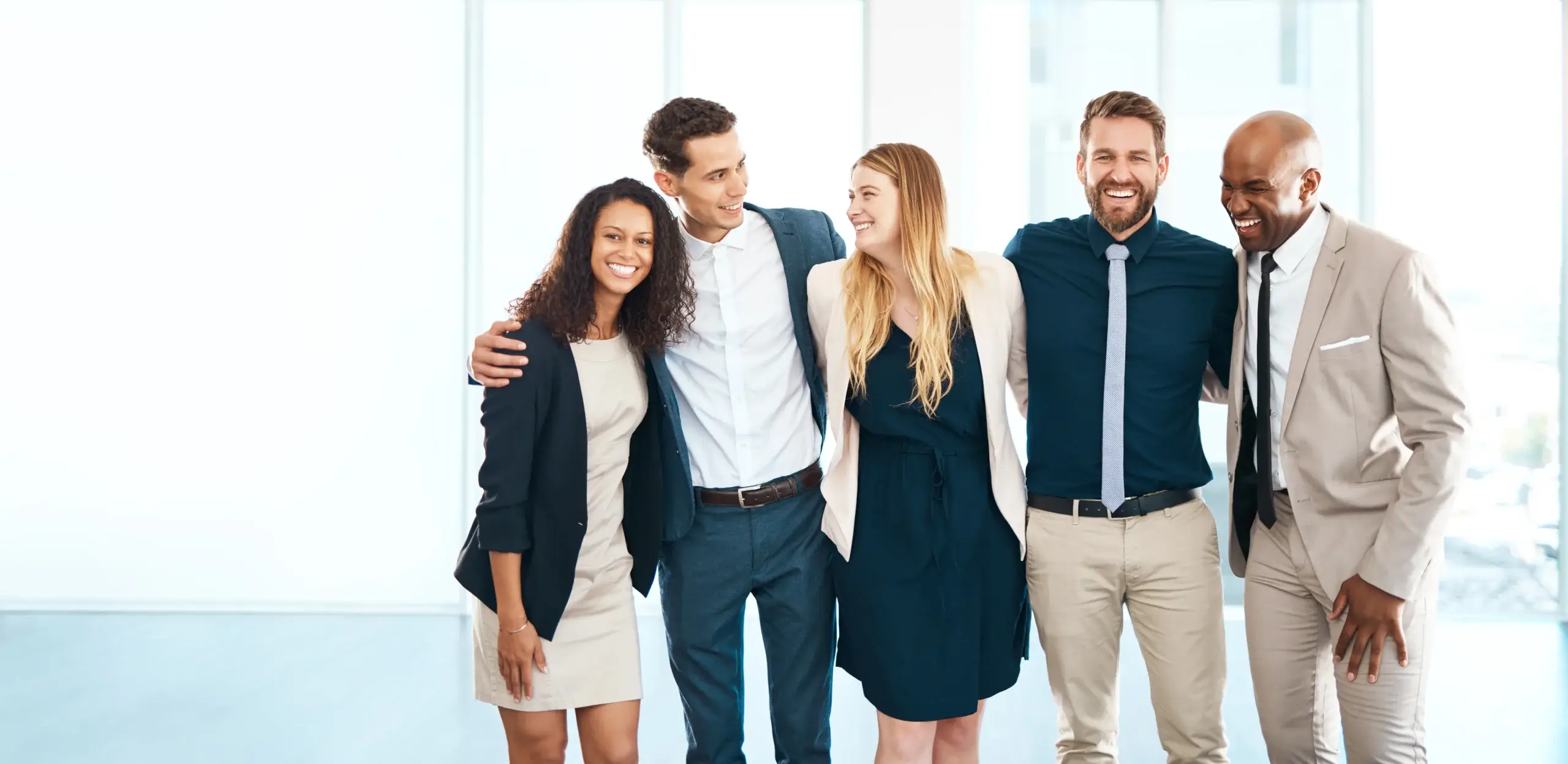 group of professionals laughing together