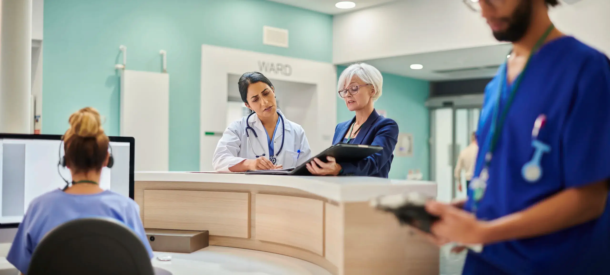 doctor talking with businessperson at the hospital