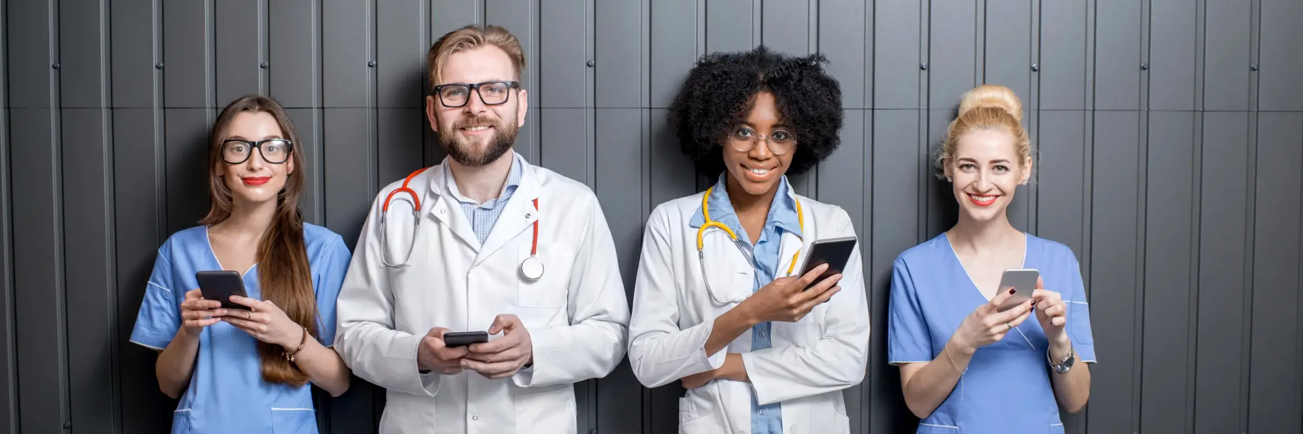 medical professionals standing with phones
