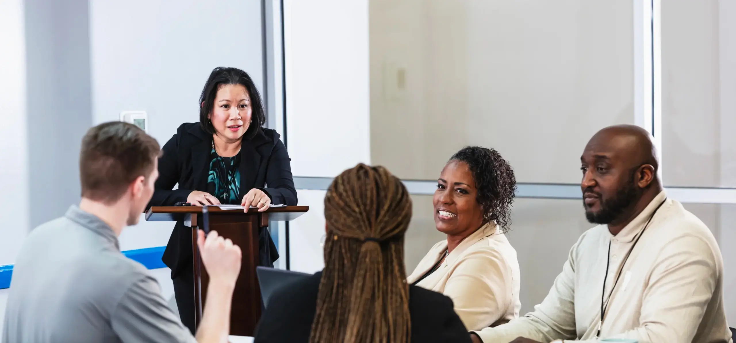A group of businesspeople get together to talk.
