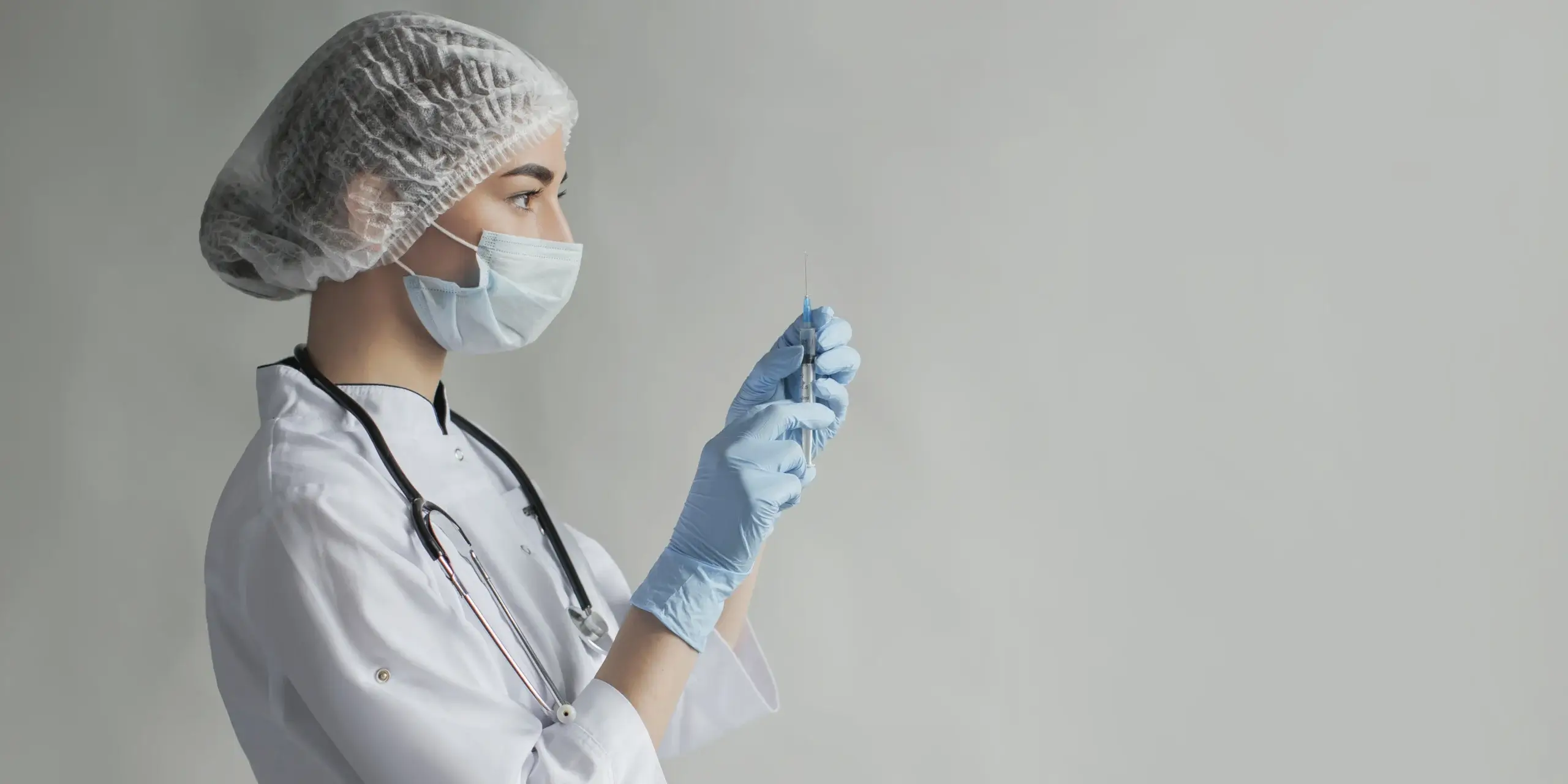 doctor holding vaccine