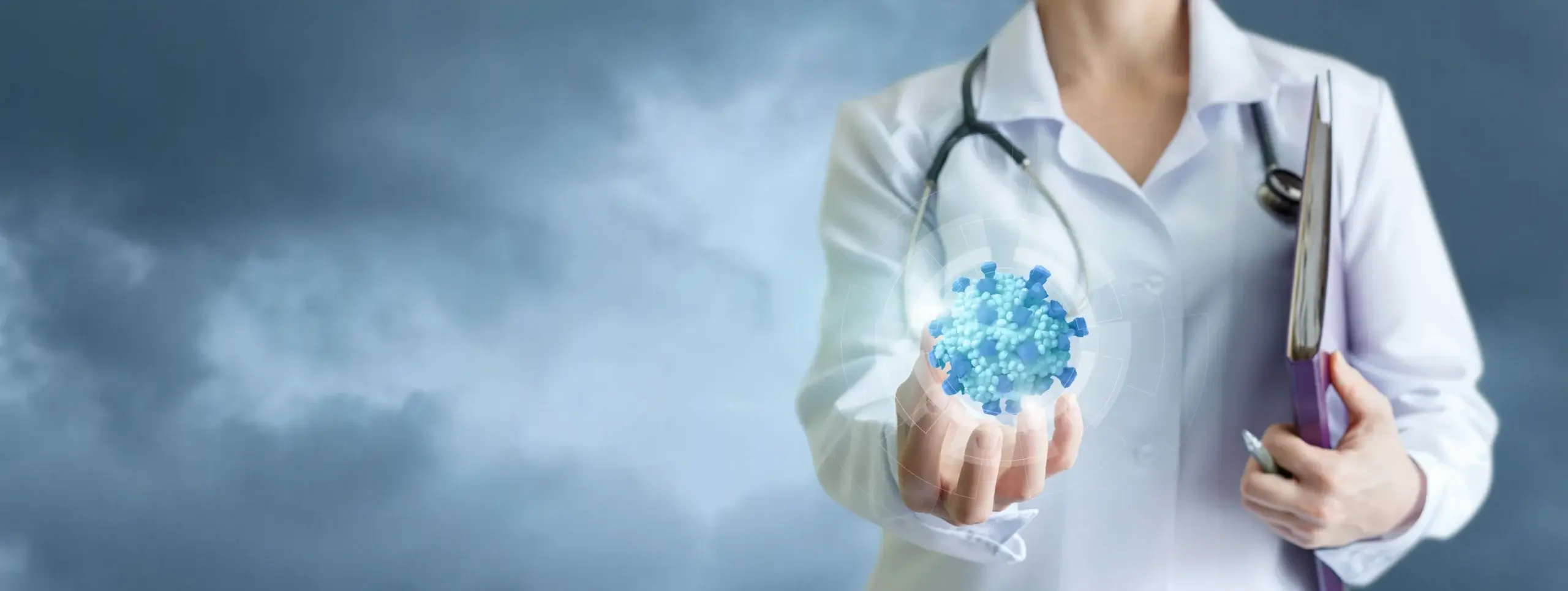 Medical professional holding graphic of virus in hand.